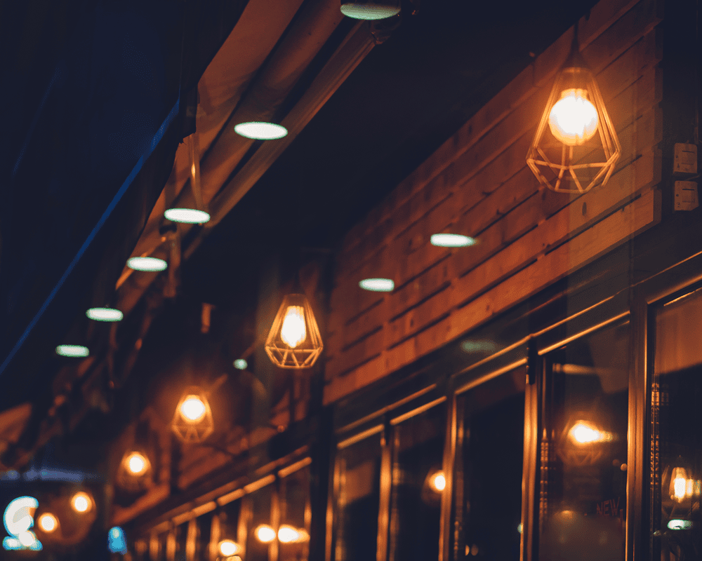 Hanging lanterns illuminating a dim street